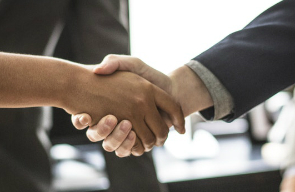 A man and woman shaking hands